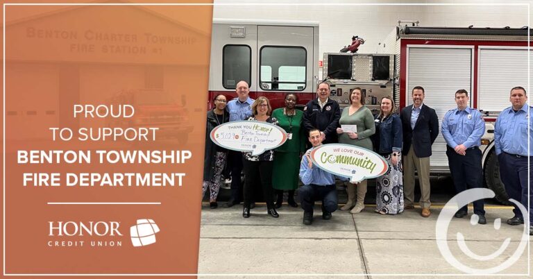 photo of honor credit union team members presenting a check to the benton township fire department