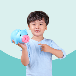 little boy holding a piggy bank and pointing to it