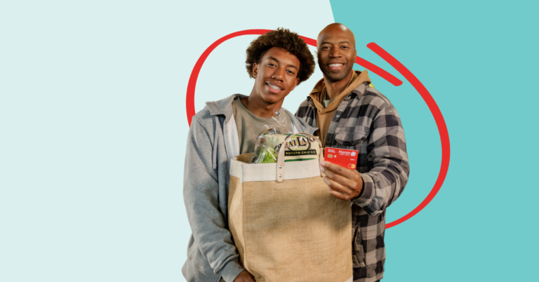 father and son grocery shopping with their Honor debit card using debit card round up