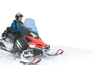 man driving a snowmobile